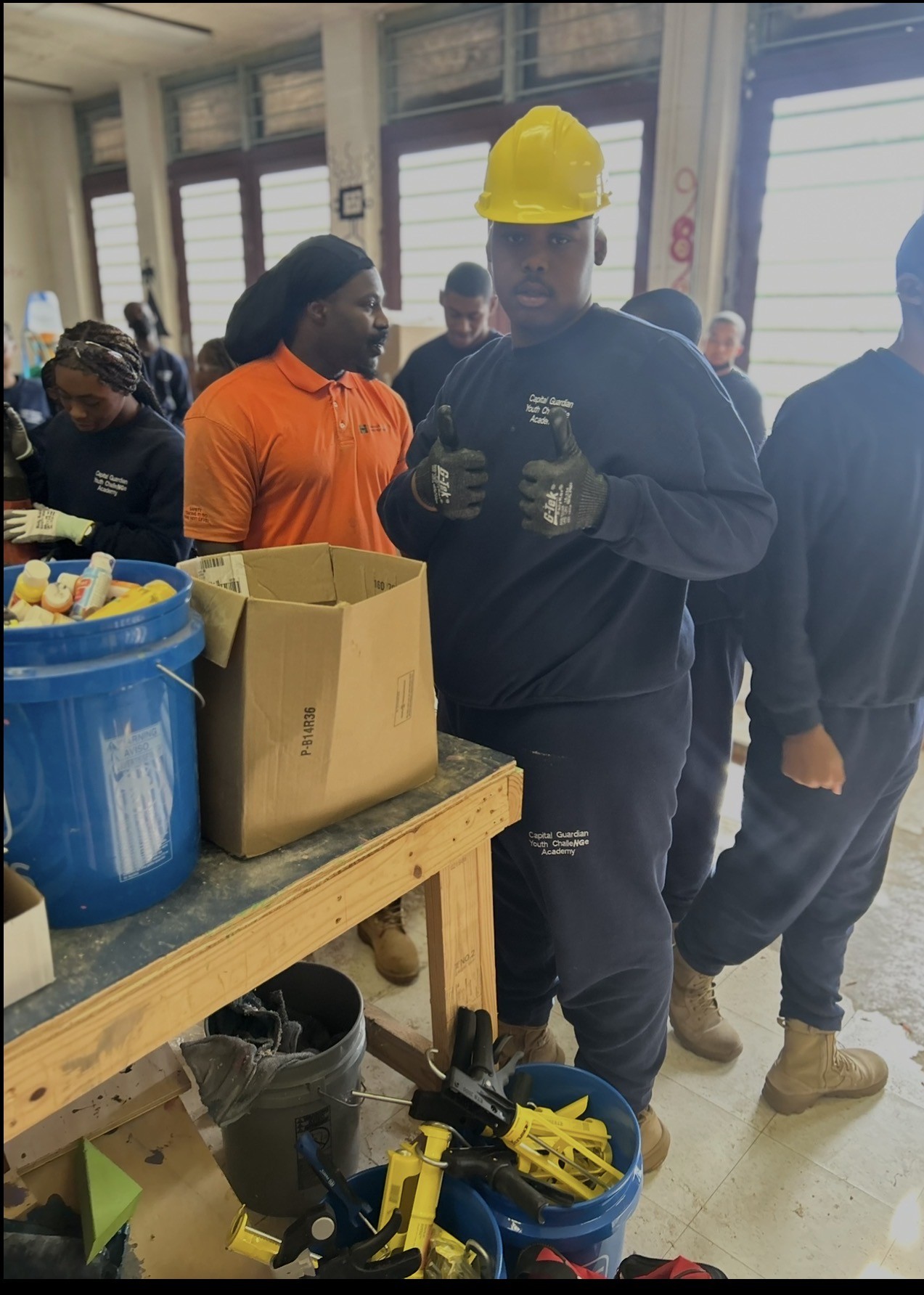Trainee wearing a hardhat and gloves during safety readiness training