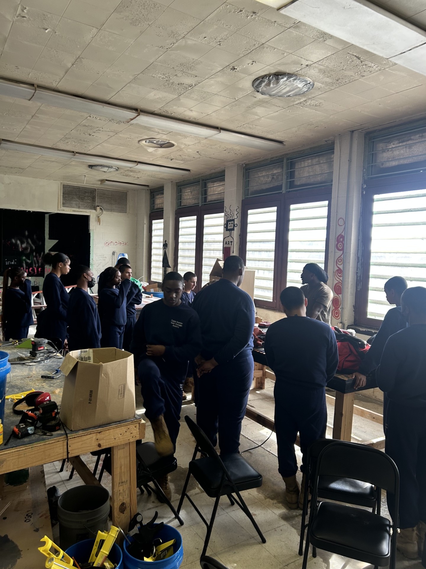 Cohort gathered in a workshop for trades safety instruction